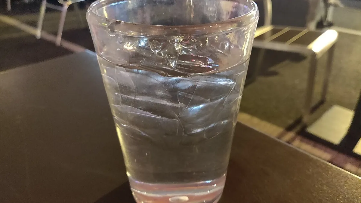 A glass of water on a table